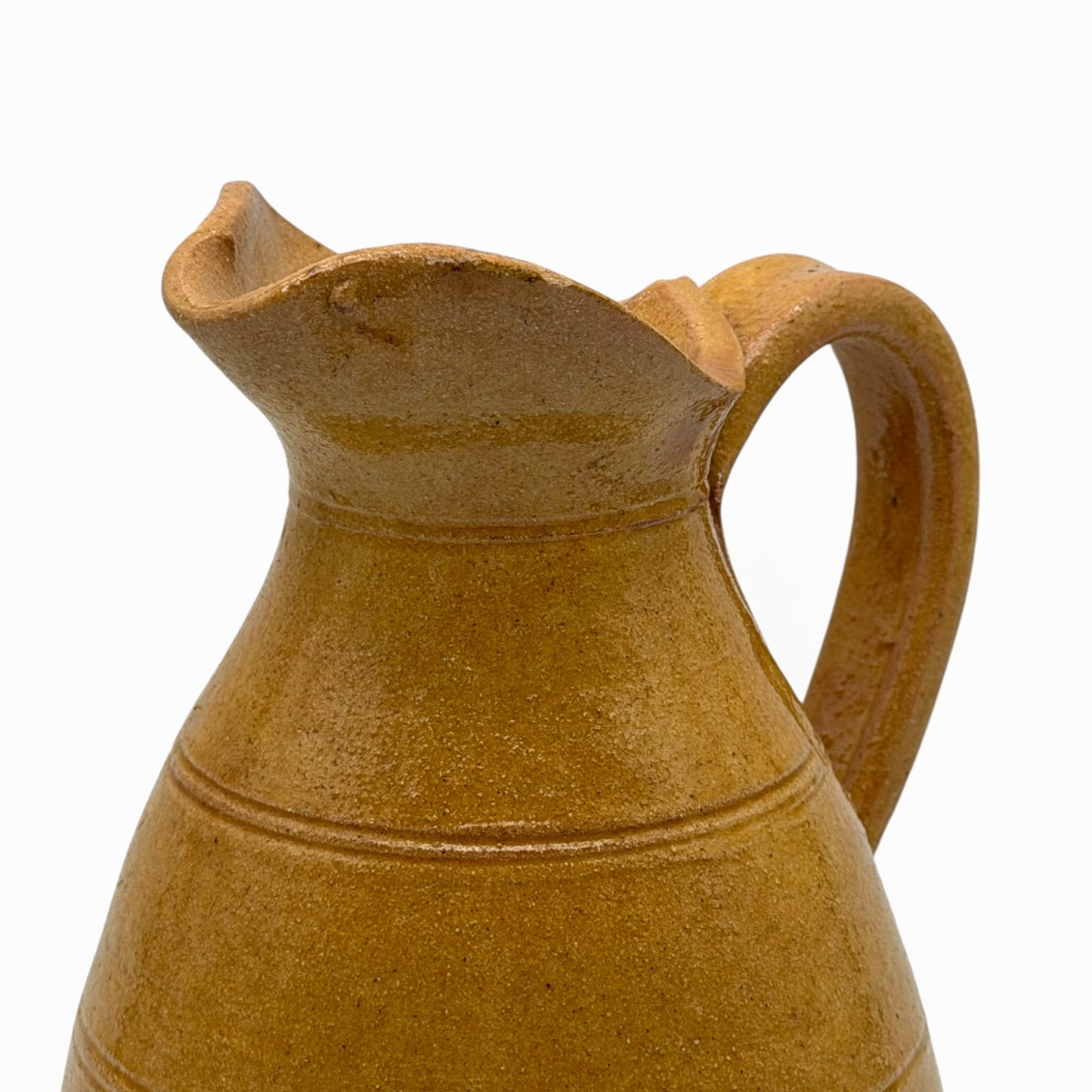 Antique French earthenware medium pitcher with ochre glaze