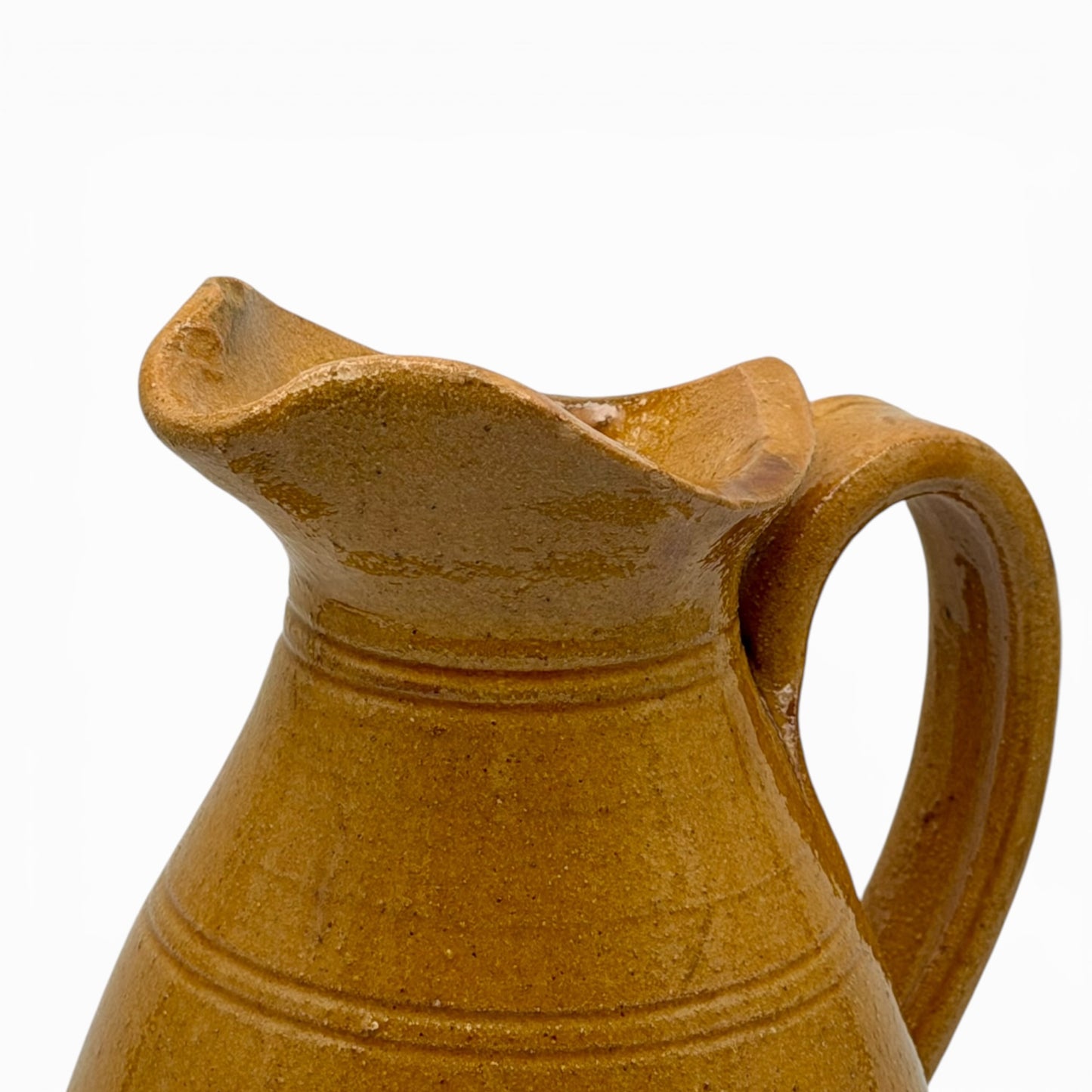 Antique French earthenware tall pitcher with ochre glaze