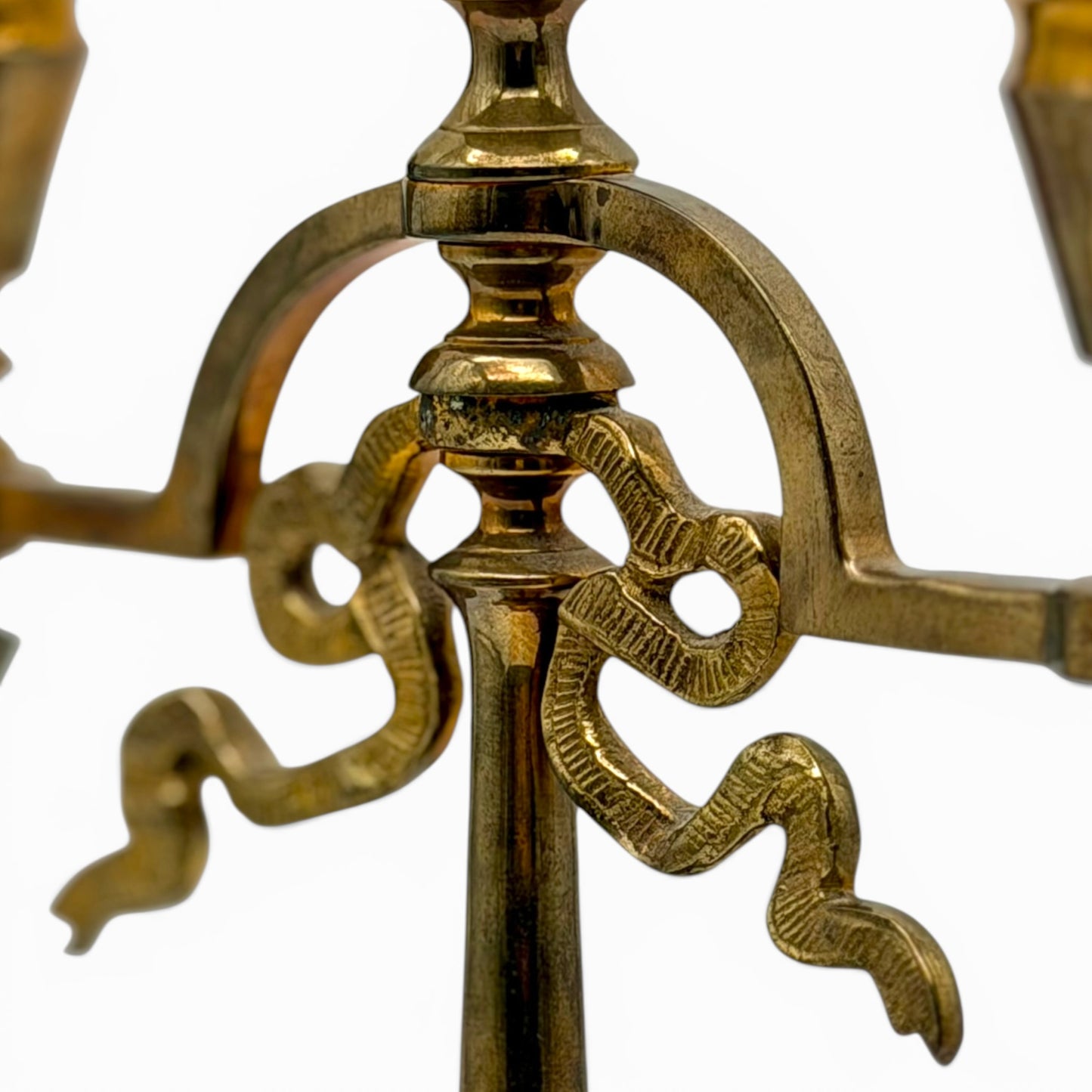 Antique two-arm brass candelabra with serpentine decorations