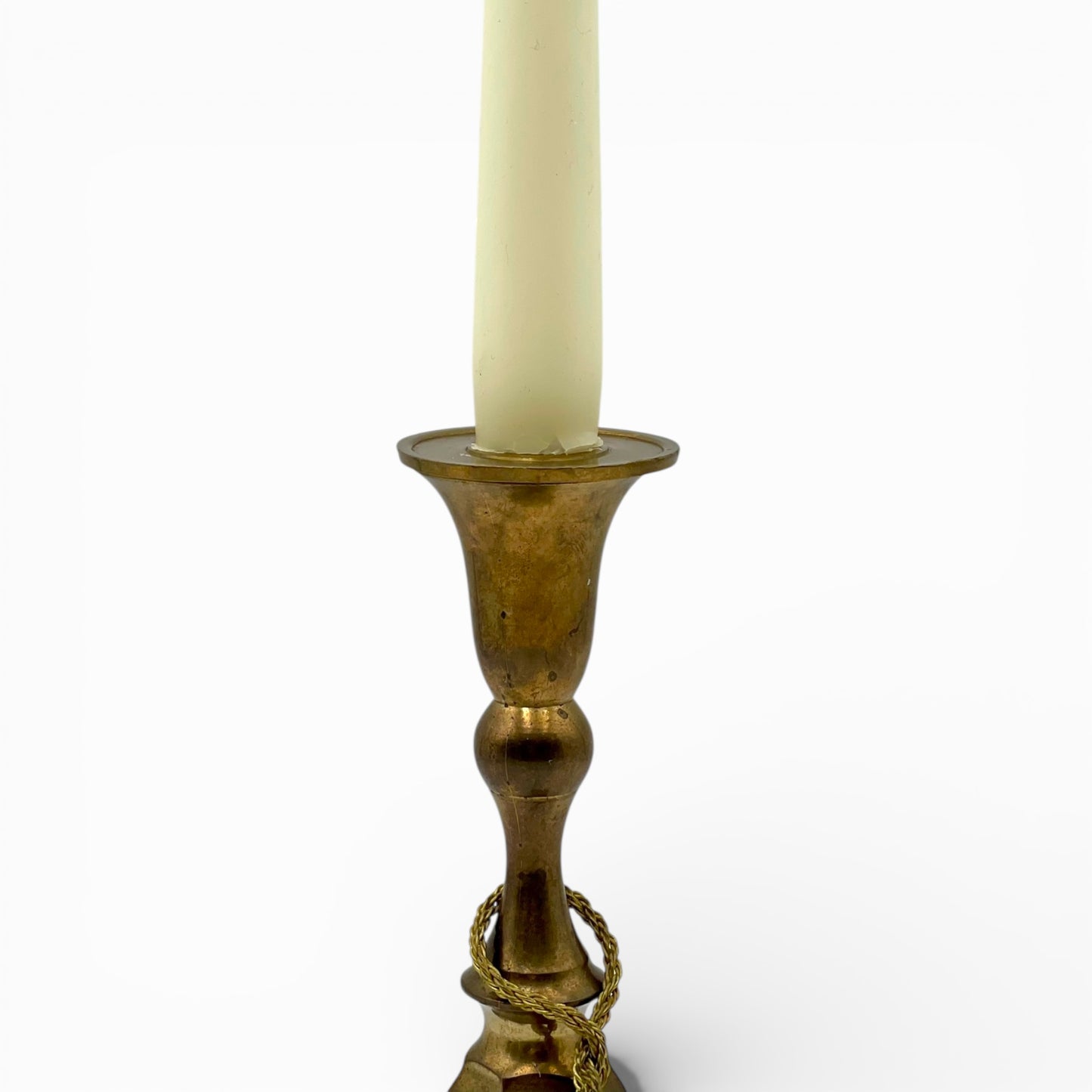 Vintage brass candlestick with rope and tassel