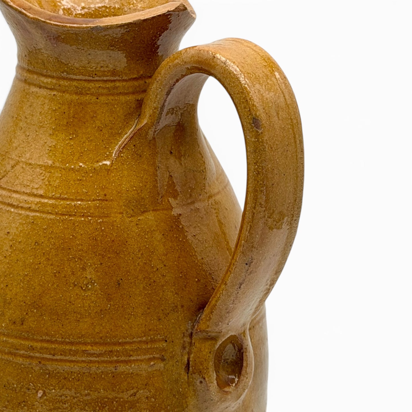 Antique French earthenware tall pitcher with ochre glaze