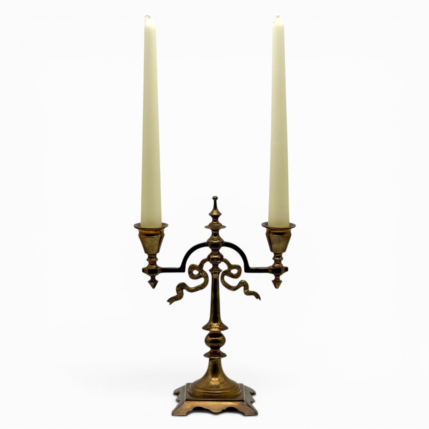 Antique two-arm brass candelabra with serpentine decorations