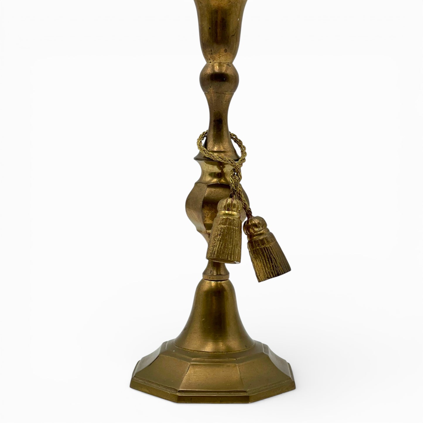Vintage brass candlestick with rope and tassel