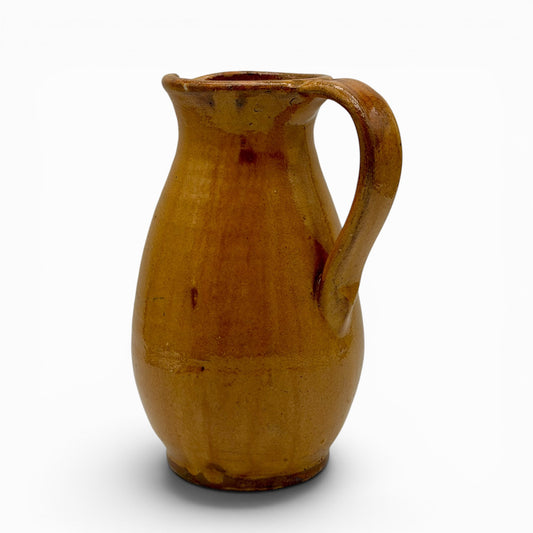 Antique French earthenware round pitcher with ochre glaze