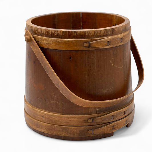 Antique wooden firkin with a bail handle