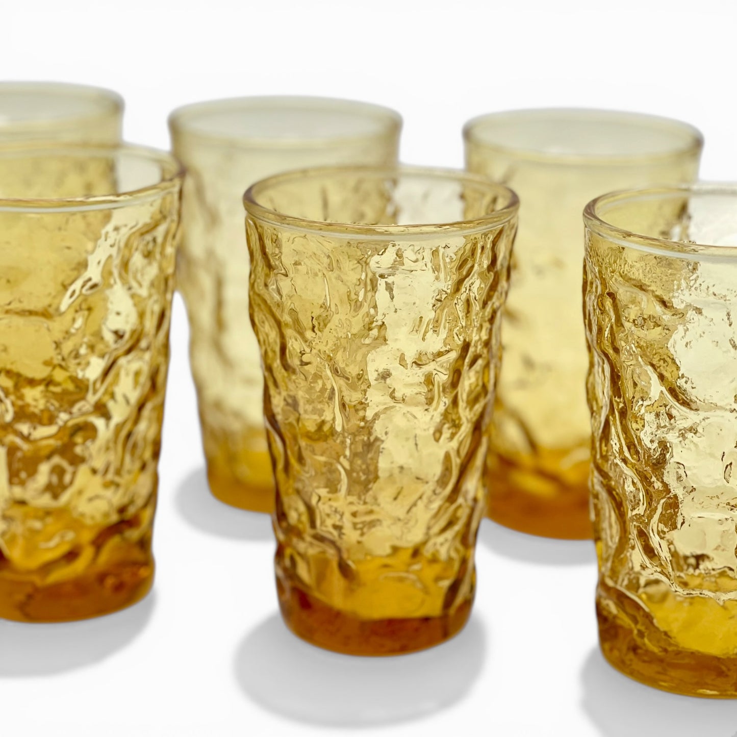 Set of seven vintage honey amber juice glasses