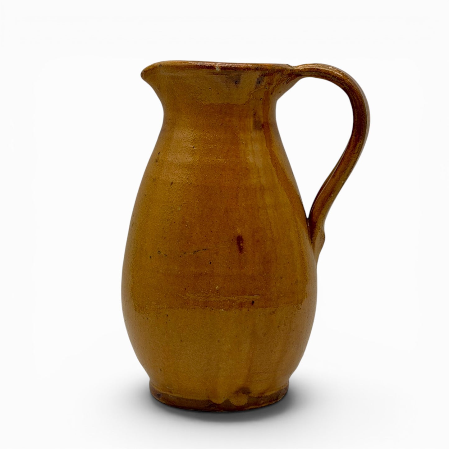 Antique French earthenware round pitcher with ochre glaze