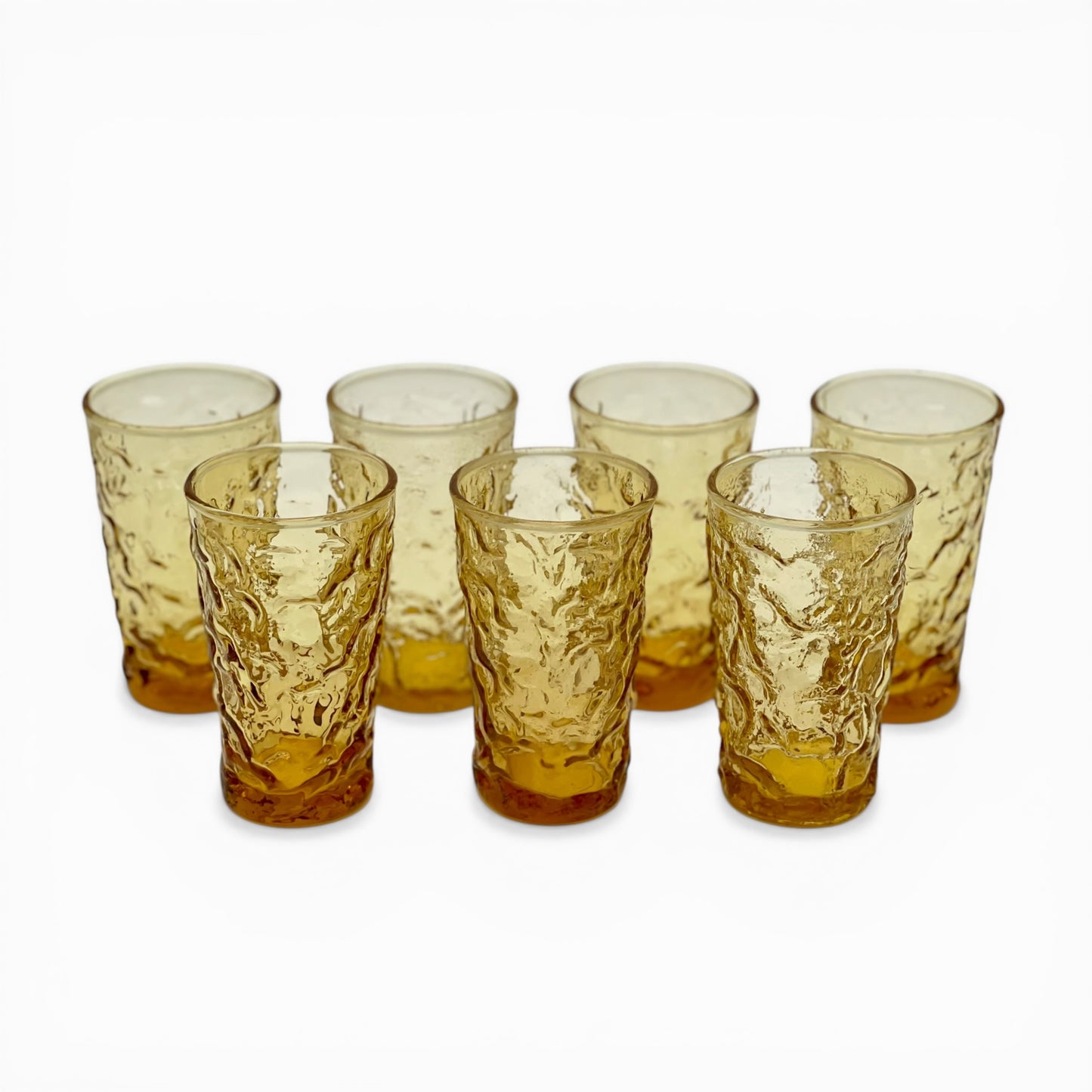 Set of seven vintage honey amber juice glasses