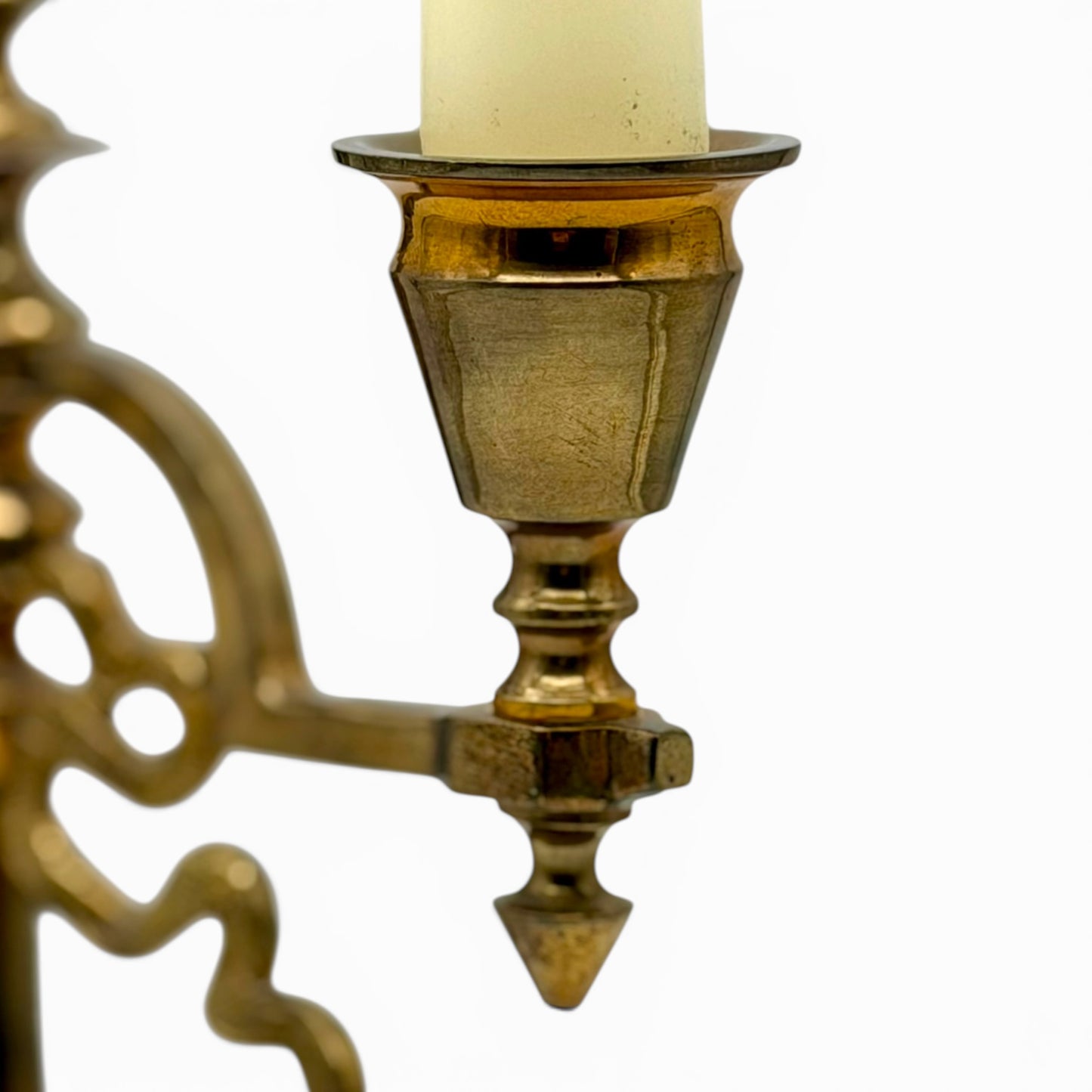 Antique two-arm brass candelabra with serpentine decorations