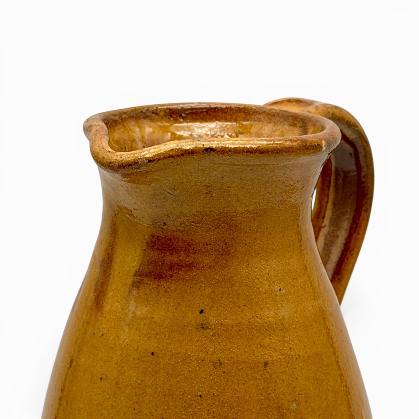 Antique French earthenware round pitcher with ochre glaze