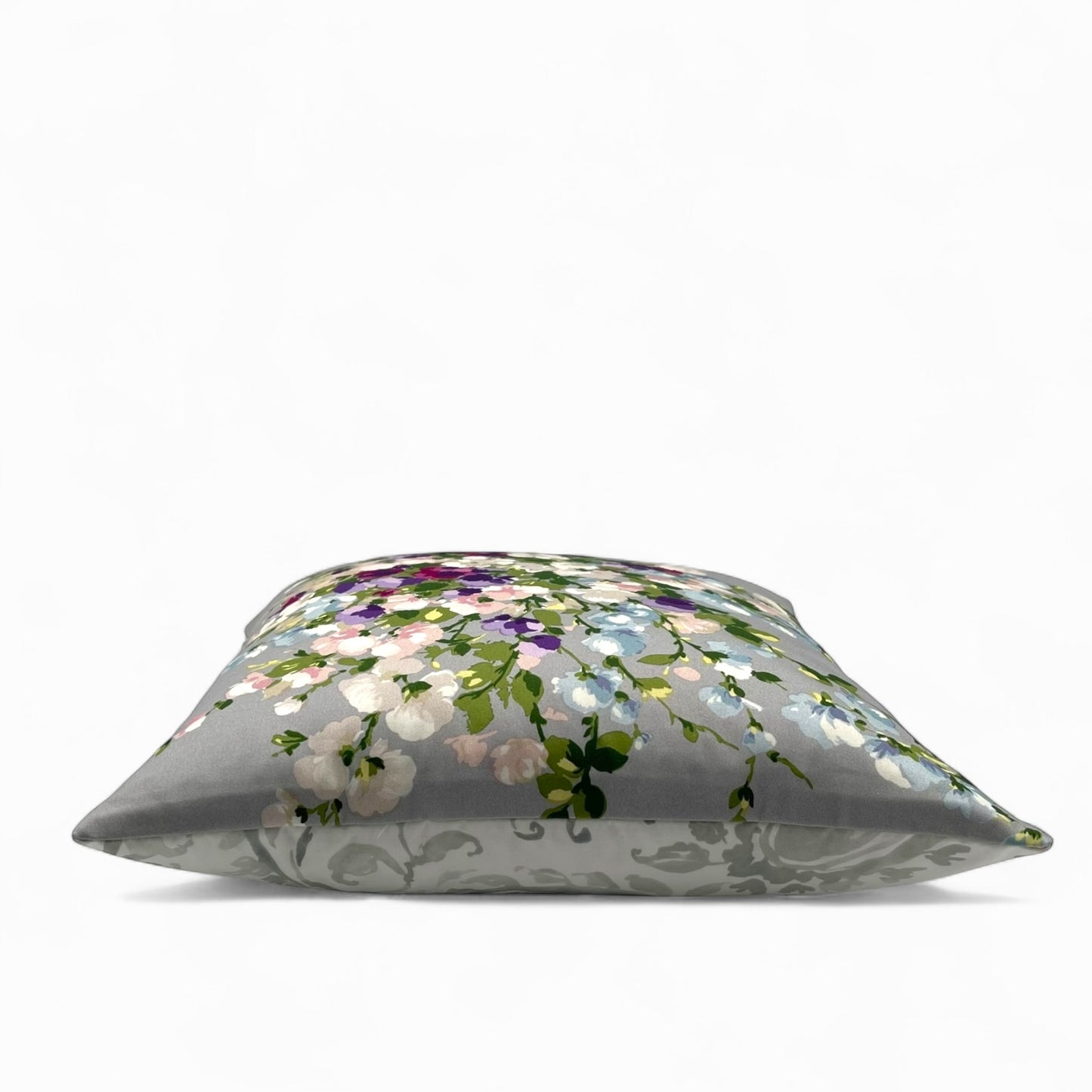 Pillow in Nina Campbell “bouquet on grey” fabric and back in jacquard pattern