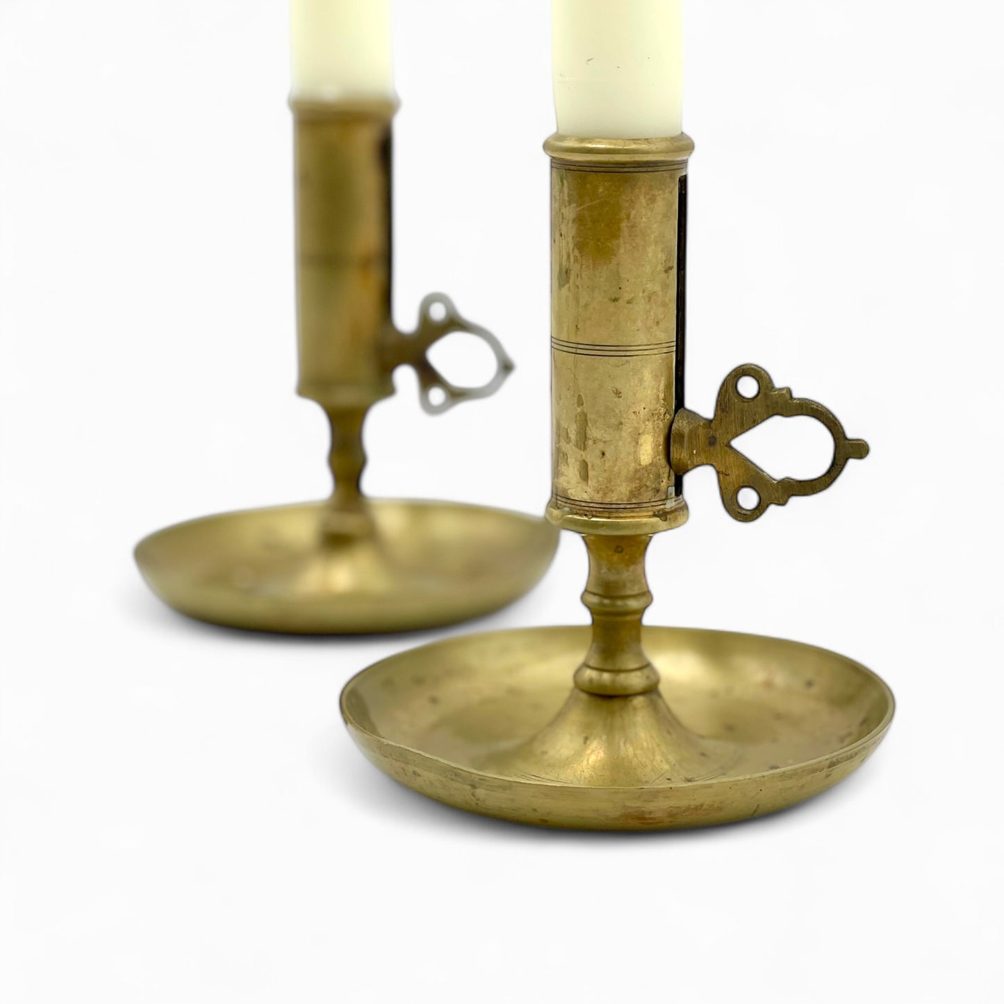 Pair of early 1900’s Swedish brass push-up chambersticks