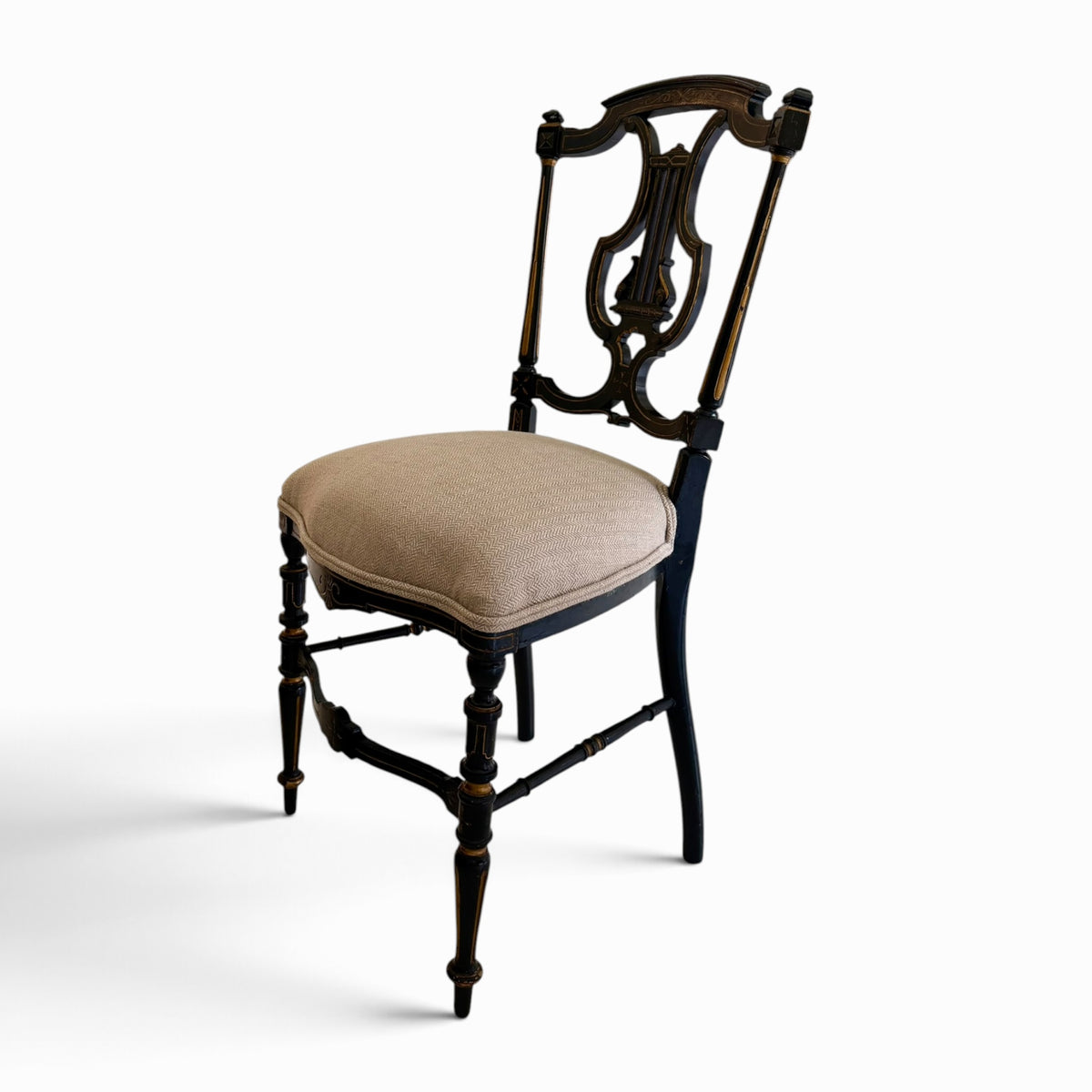Pair of English Regency Ebonized & Parcel-Gilt Lyre-Back Side Chairs, c. 1820