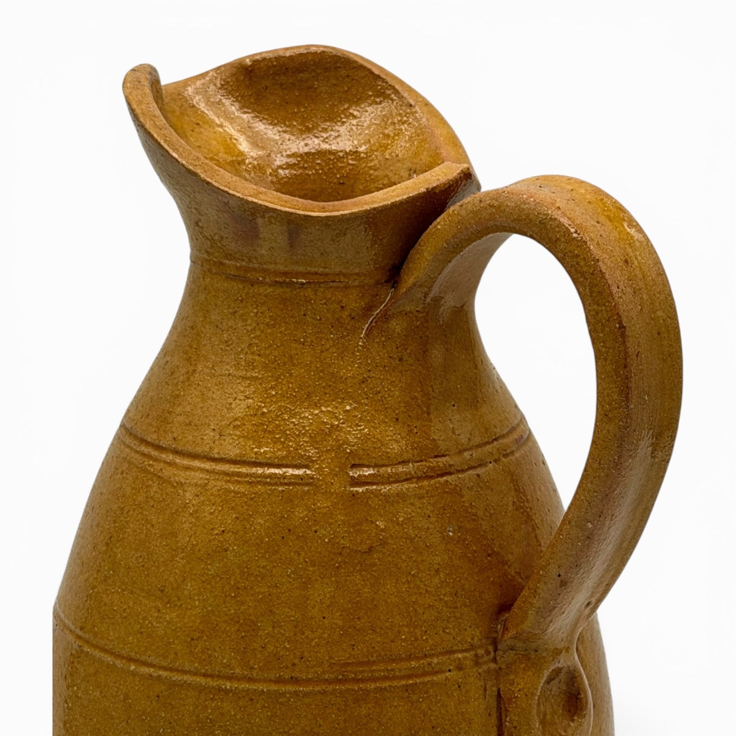 Antique French earthenware medium pitcher with ochre glaze