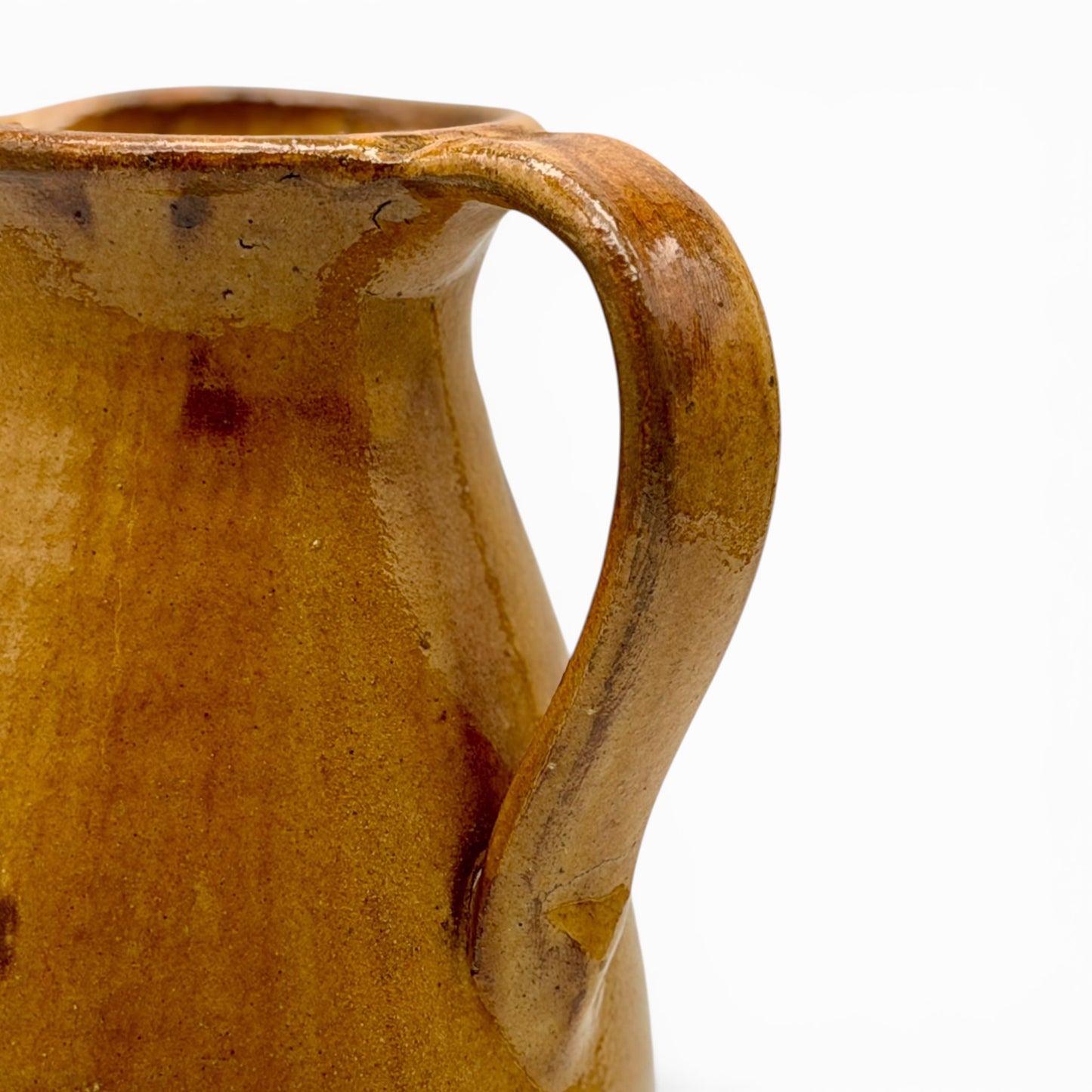 Antique French earthenware round pitcher with ochre glaze