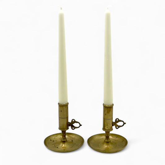 Pair of early 1900’s Swedish brass push-up chambersticks